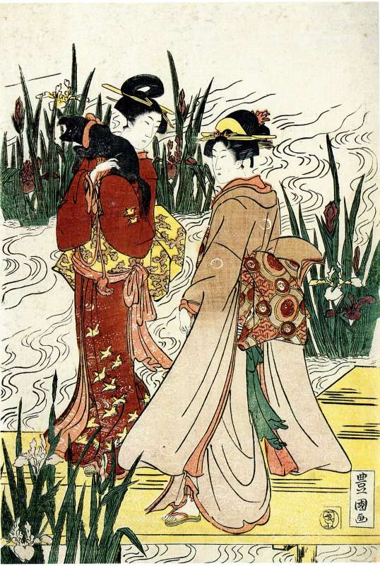 Two women walk on a footbridge among waterlilies, one of them holding a dog